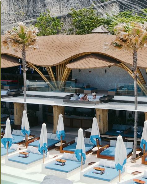 Infinity pool, beach club, and outdoor cabanas overview